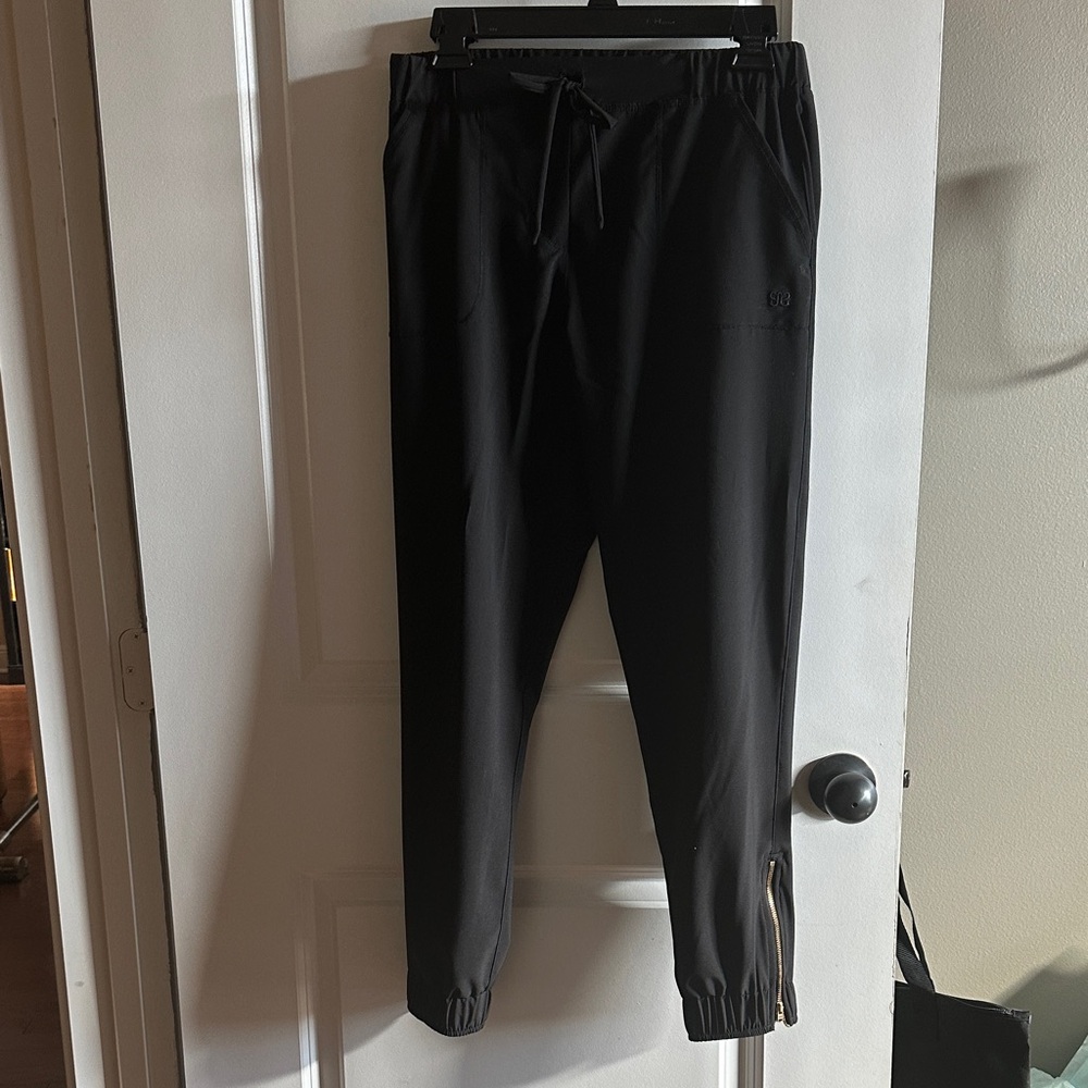 Albion Black Jogger Pants lightweight with zip ankle. Size small.